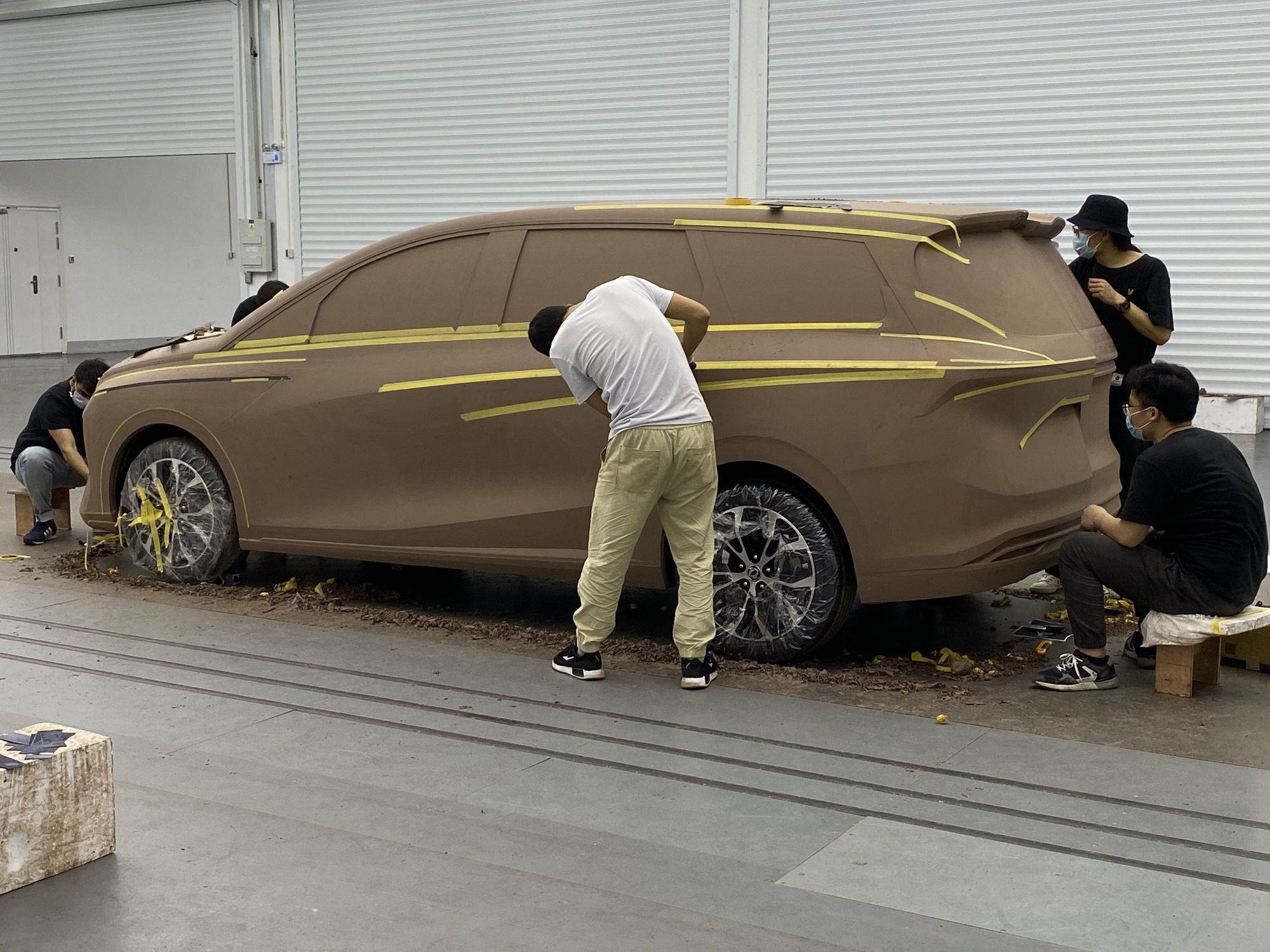 Team working on the clay body side