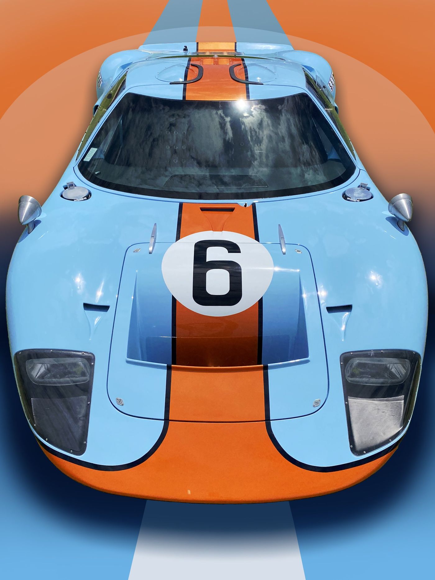 Light blue and orange racing car, number 6